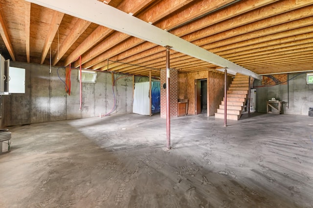 2466 655th Ave, Albia, IA 52531 - basement with stairway and gas water heater