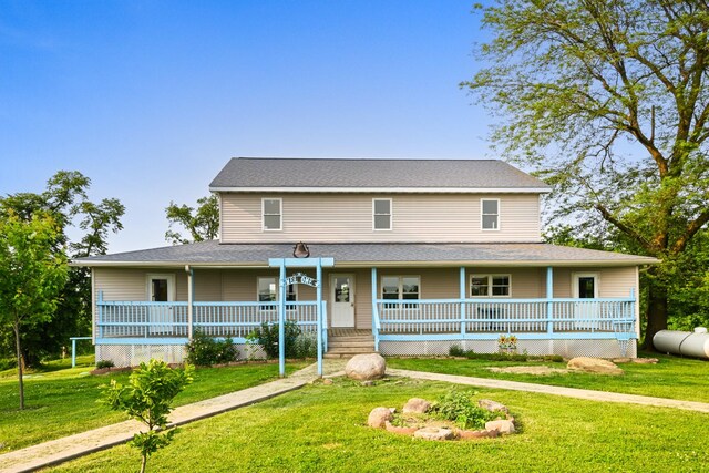 2466 655th Ave, Albia, IA 52531 - farmhouse inspired home with covered porch and a front yard