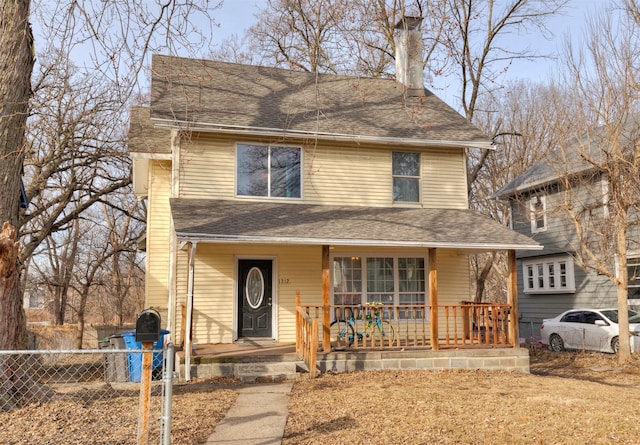 view of property featuring covered porch