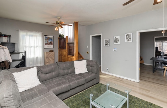 living room with ceiling fan and wood-type flooring