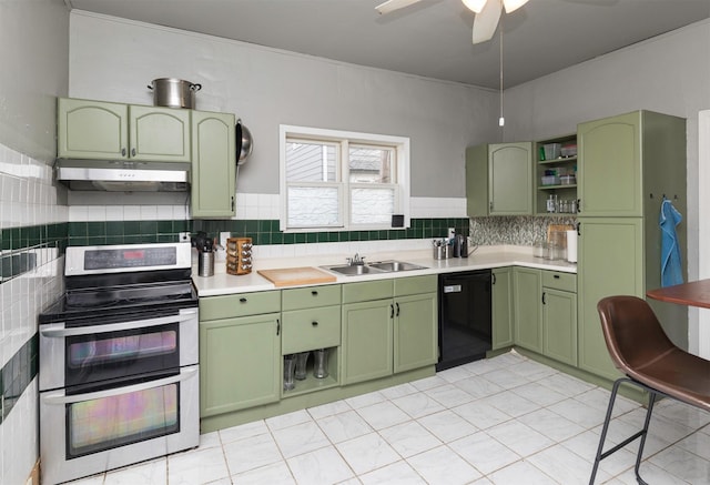 kitchen featuring tasteful backsplash, dishwasher, sink, double oven range, and green cabinets