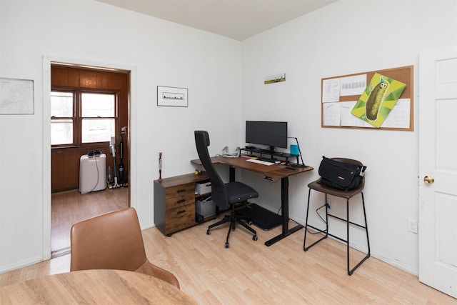 home office with light wood-type flooring