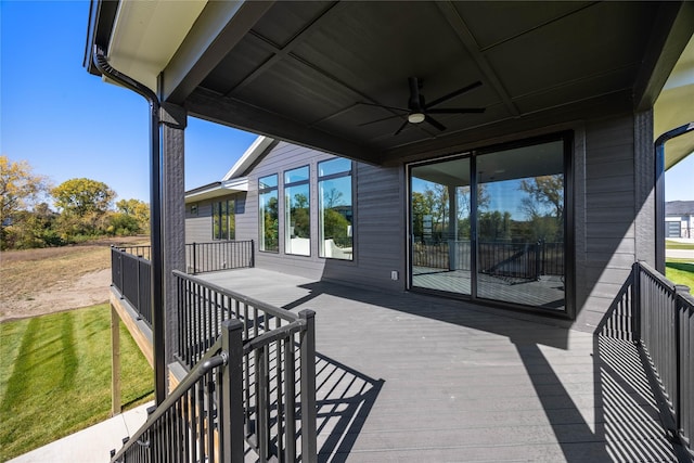 wooden terrace featuring ceiling fan