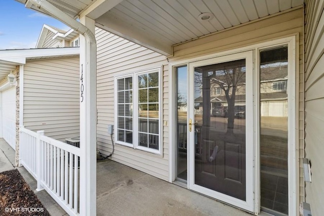 property entrance featuring a patio area