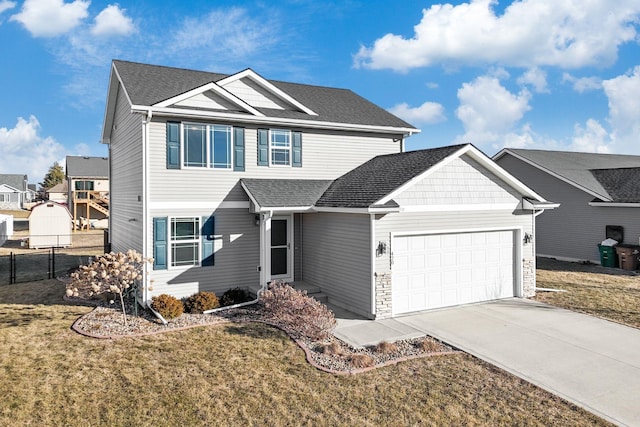 view of front of house with a garage and a front lawn