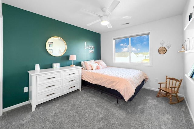 bedroom featuring ceiling fan and dark colored carpet