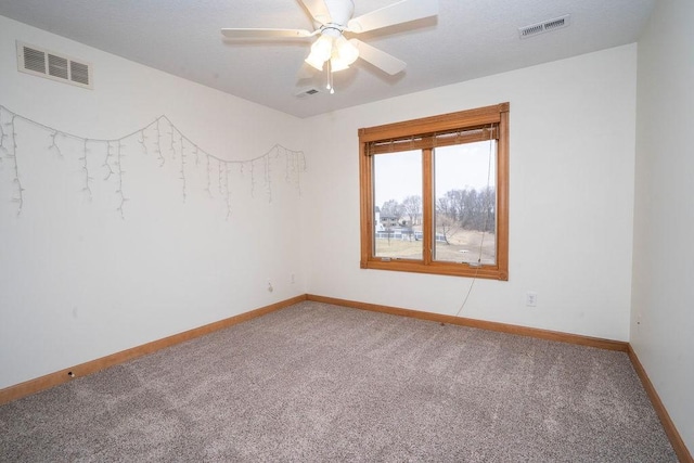 empty room with carpet floors and ceiling fan