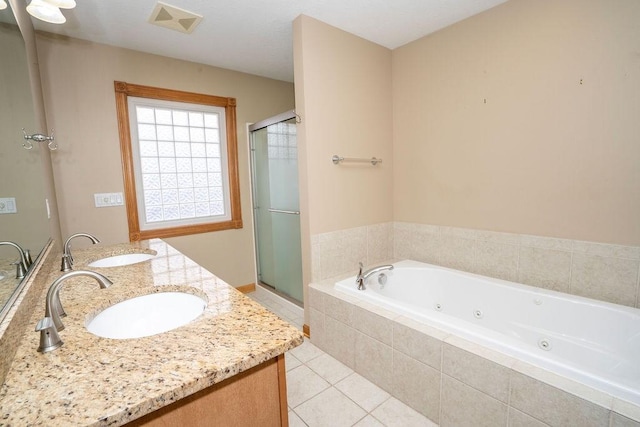 bathroom featuring tile patterned floors, plus walk in shower, and vanity