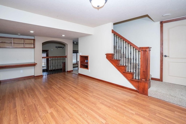 unfurnished living room with light hardwood / wood-style flooring