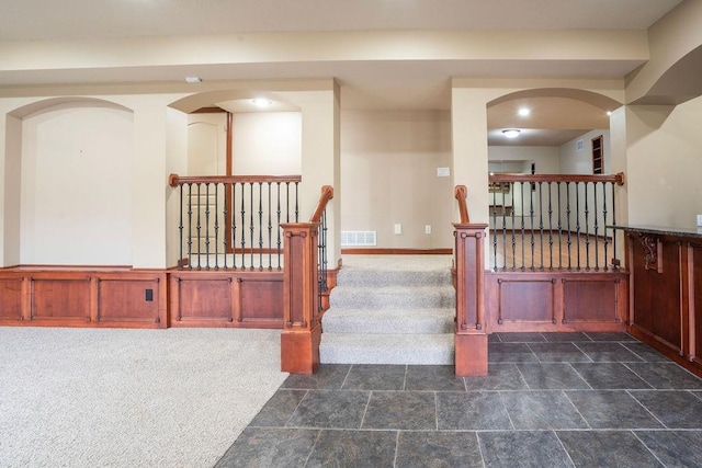 staircase with carpet floors