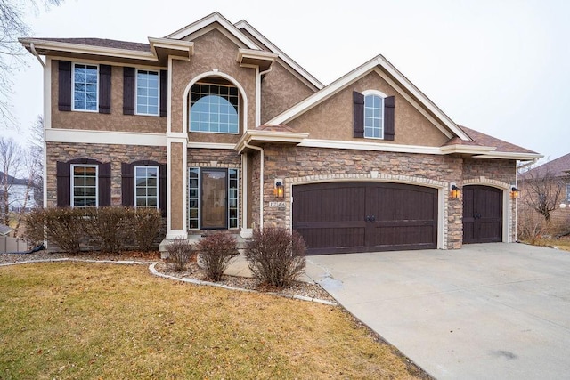 view of front of property with a garage and a front yard