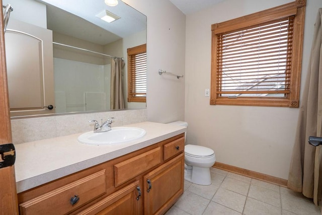 bathroom with vanity, curtained shower, tile patterned floors, and toilet