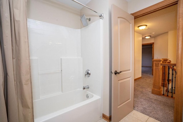 bathroom with tile patterned floors and shower / bath combination with curtain