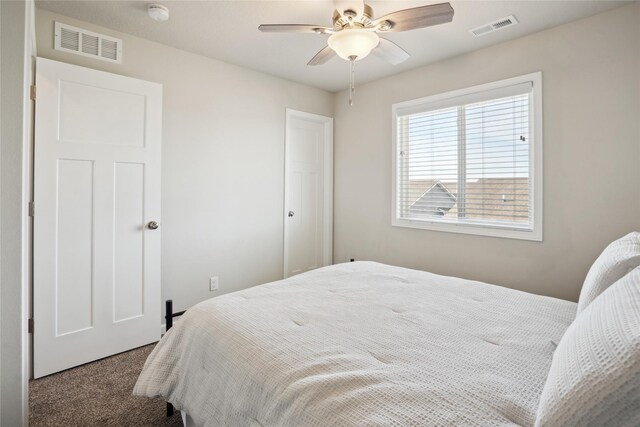 carpeted bedroom with ceiling fan