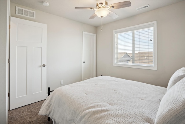 bedroom with ceiling fan, carpet floors, and visible vents