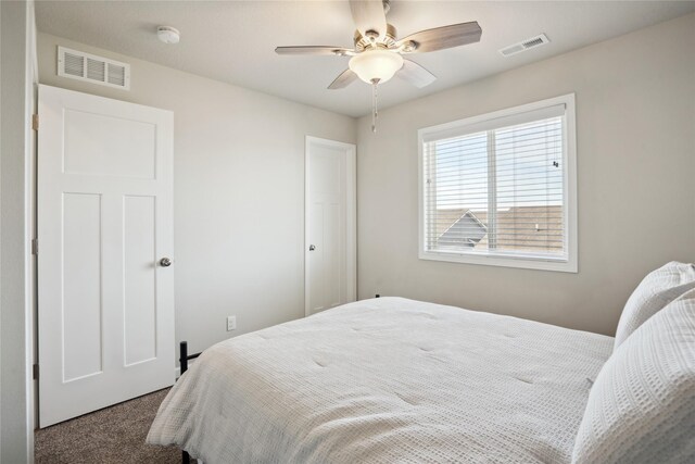 bedroom featuring ceiling fan and carpet