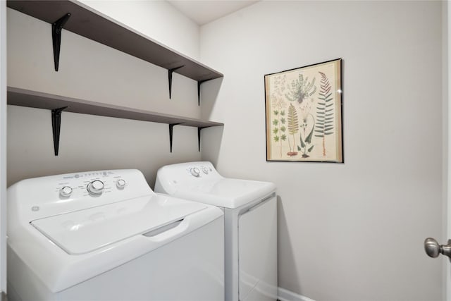 laundry room with washer and dryer and laundry area