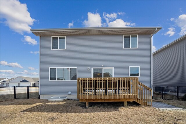 rear view of house featuring a deck