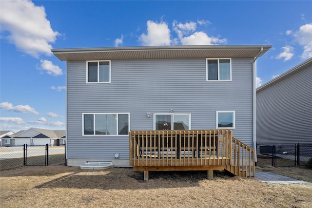 back of property featuring fence and a deck