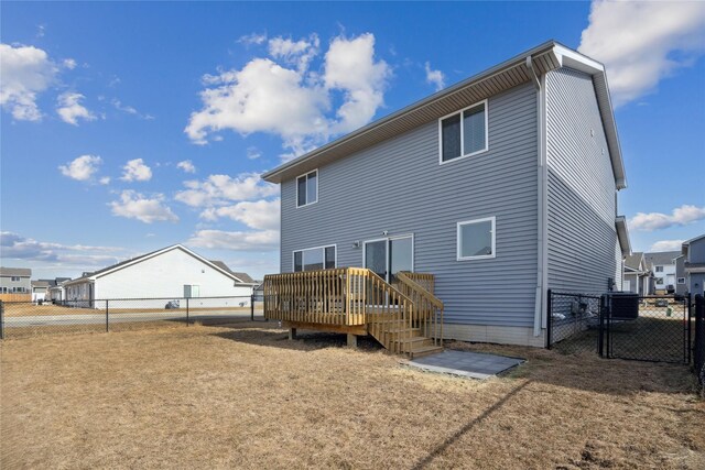 back of property featuring a wooden deck and central air condition unit