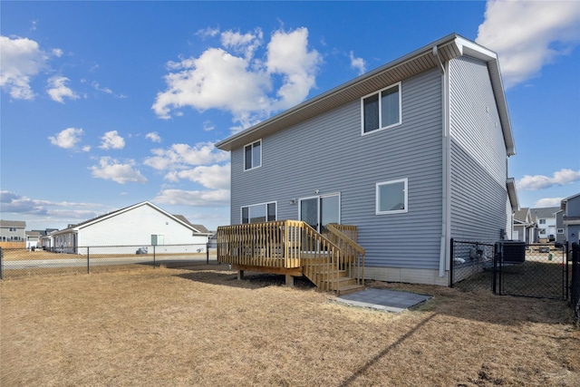 back of property featuring cooling unit, fence, and a wooden deck