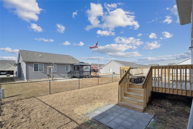 view of yard with a gazebo and a wooden deck