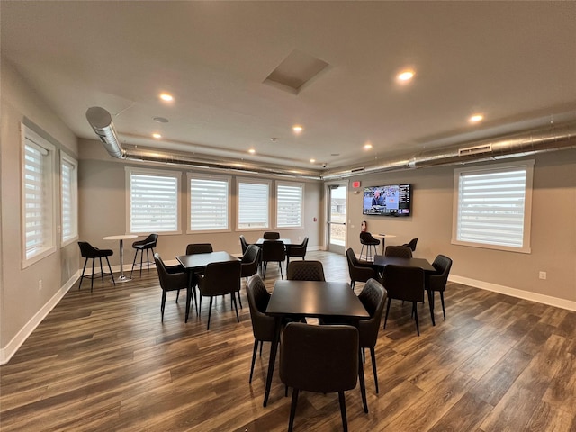 dining area with dark wood-type flooring