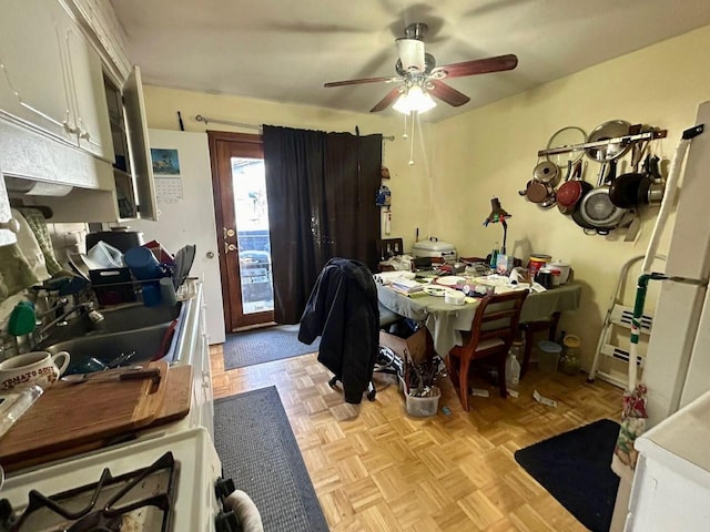 dining room featuring light parquet floors and ceiling fan