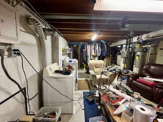 basement featuring washer and dryer and water heater