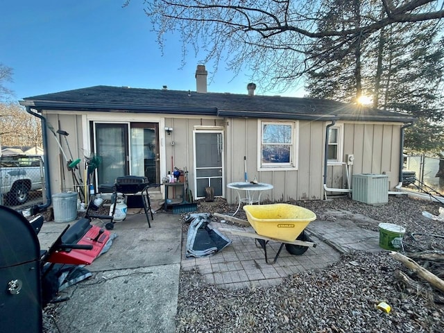 rear view of property featuring cooling unit and a patio