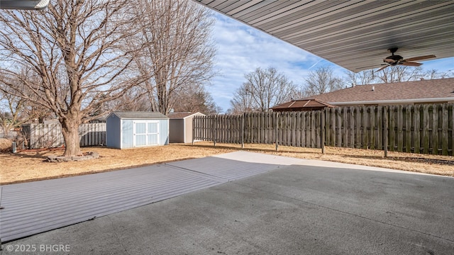 view of patio / terrace featuring ceiling fan and a storage shed