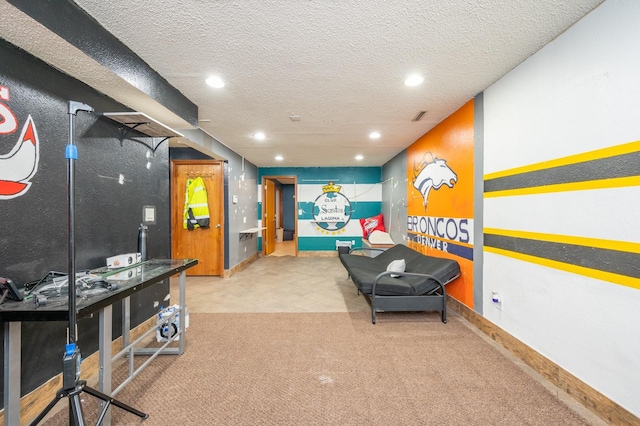 interior space with light carpet and a textured ceiling