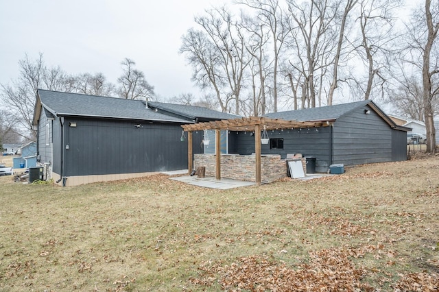 rear view of house with a pergola, a lawn, central air condition unit, and a patio area