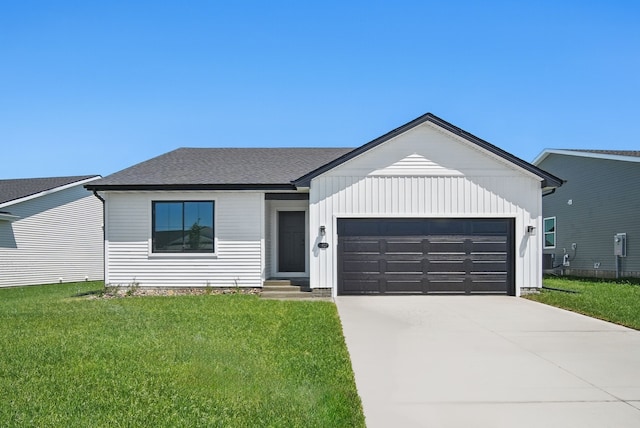 1927 Tuscany Dr SE, Altoona, IA 50009 - view of front of property with an attached garage, a front lawn, concrete driveway, and entry steps