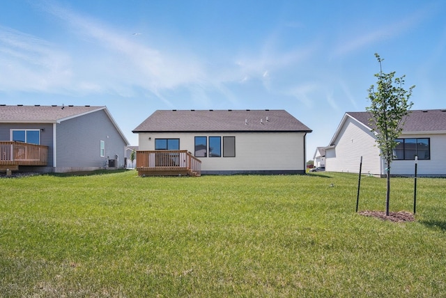 1927 Tuscany Dr SE, Altoona, IA 50009 - back of house featuring a deck and a lawn