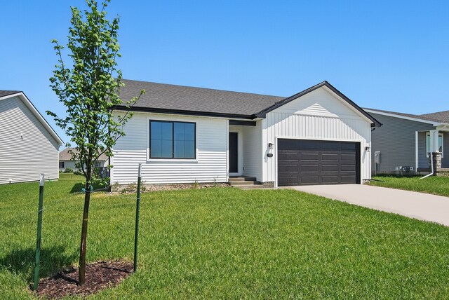 1927 Tuscany Dr SE, Altoona, IA 50009 - view of front of property with a garage, driveway, and a front lawn