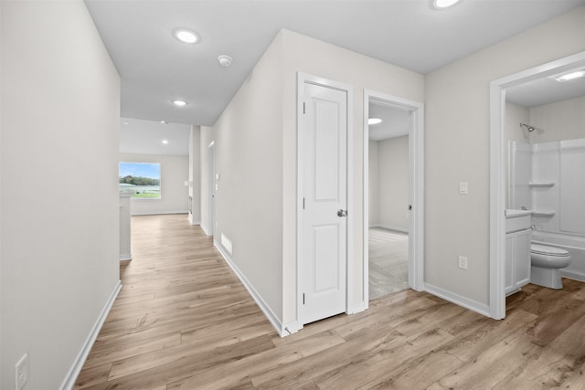 hall featuring light hardwood / wood-style floors