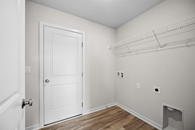 washroom featuring washer hookup, wood-type flooring, and electric dryer hookup