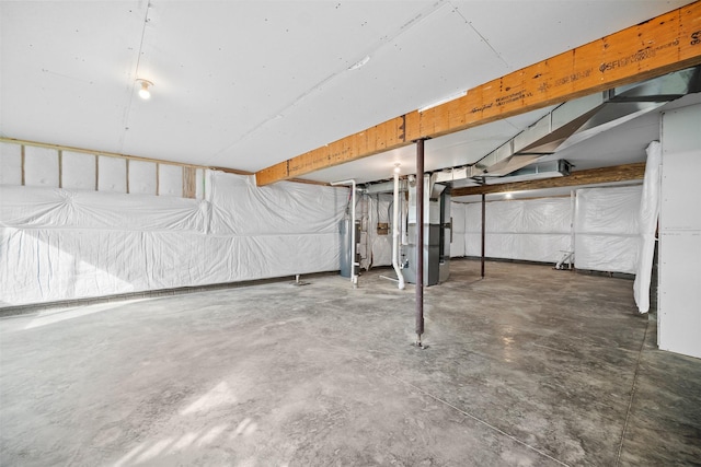 basement with water heater and heating unit