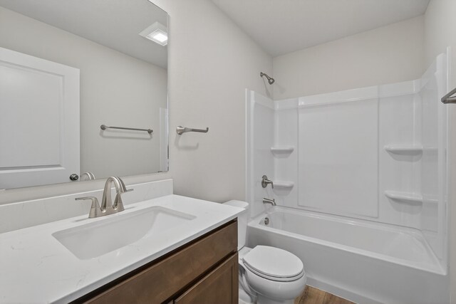 1835 Tuscany Dr SE, Altoona, IA 50009 - bathroom with vanity, washtub / shower combination, and wood finished floors