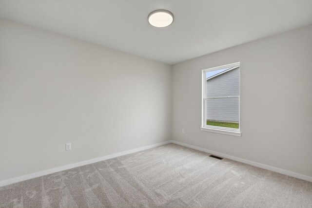 1835 Tuscany Dr SE, Altoona, IA 50009 - spare room with light colored carpet and plenty of natural light