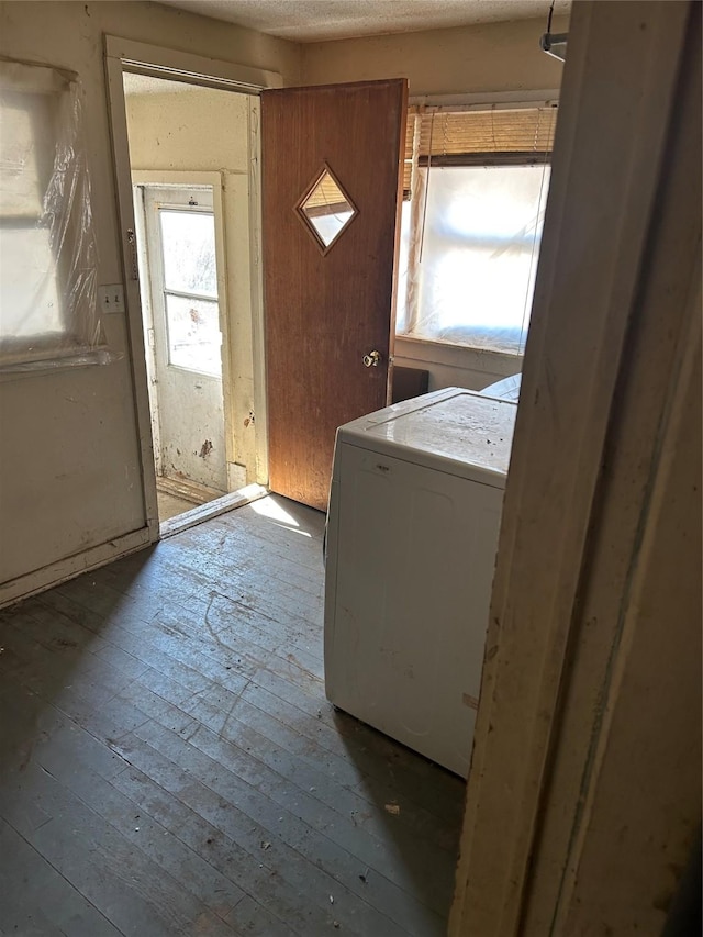 washroom featuring washer / dryer and light hardwood / wood-style flooring