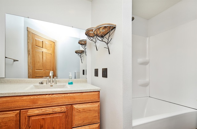 bathroom featuring vanity and shower / bathtub combination