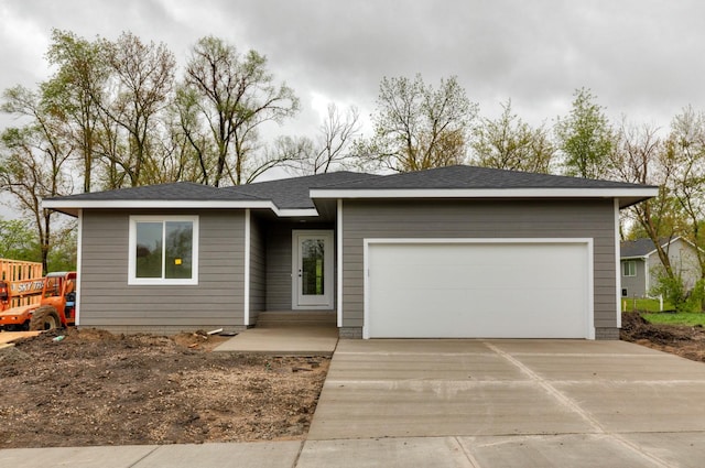 view of front of property with a garage