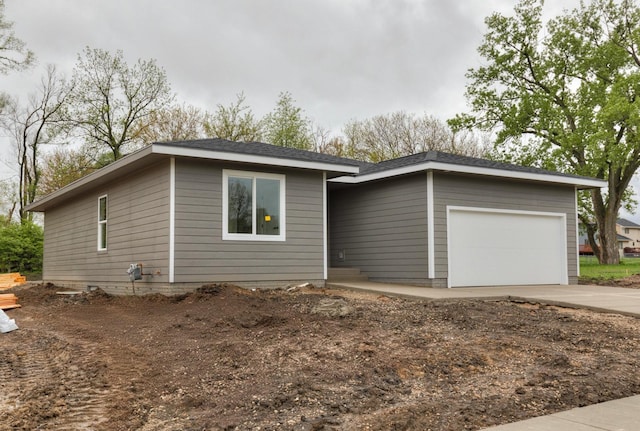 ranch-style home featuring a garage