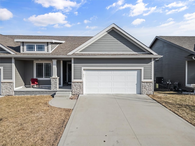 craftsman-style house with a porch and a garage