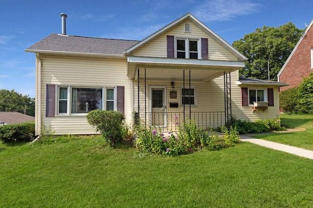 view of front facade with a porch and a front lawn