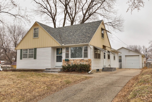 view of front of property featuring a garage and an outdoor structure