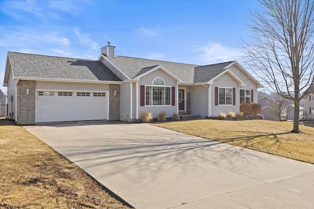 ranch-style house featuring a garage and a front yard