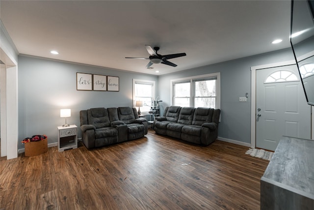 living room featuring ornamental molding, dark hardwood / wood-style floors, and ceiling fan